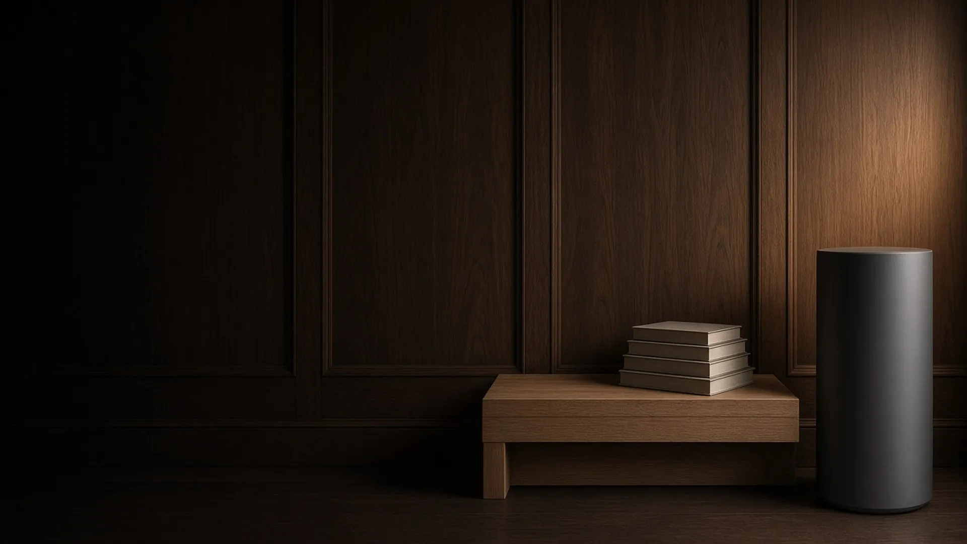 A tall graphite air purifier beside a low bench holding five books, against dark wood paneling