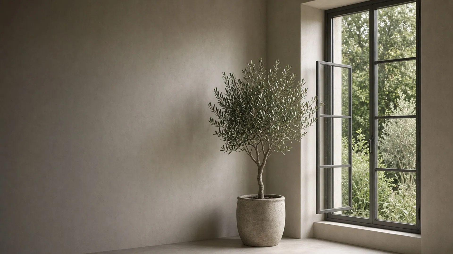 An open window onto a garden in a bright room